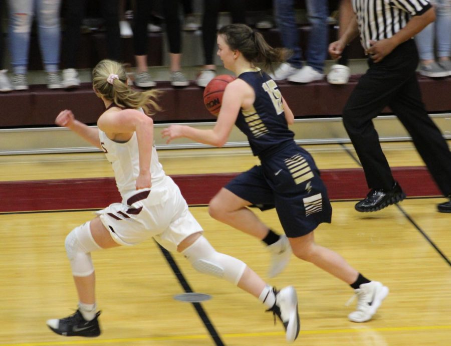 Emma Keaser, 12th grade, races across the court.