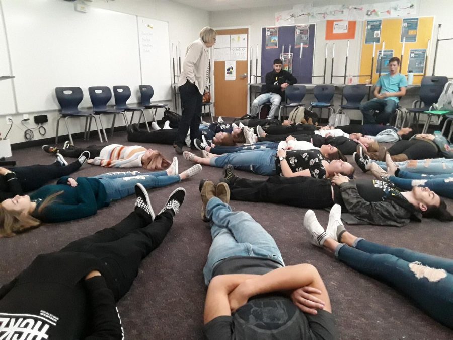 Mills leads the first hour psychology class through a relaxation activity. Making students close their eyes, she tells them to imagine they are floating into a state of deep relaxation, drifting and floating, drifting and floating. Afterwards, students reported feeling like they were floating or sinking (depending on the individual) during the exercise.
