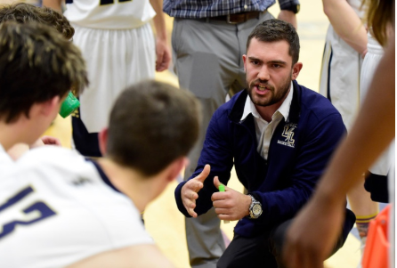 -Photo via Max Preps-Head Coach, Connor Clay strategizing the game plan for what he thinks will best help the team win