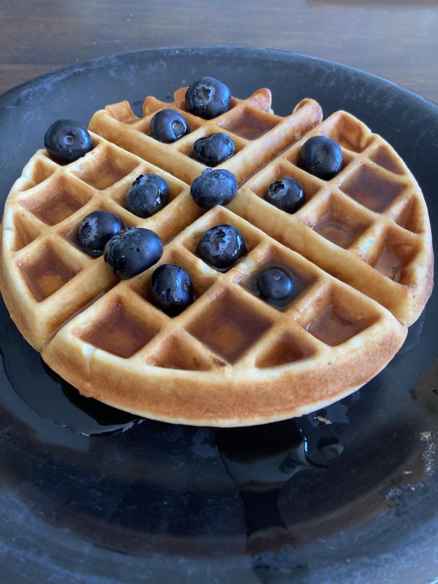 Syrupy waffles topped with blueberries